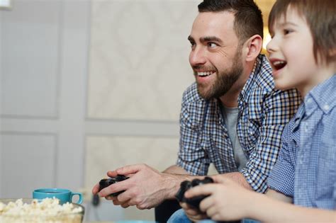 Free Photo Father And Son Gaming