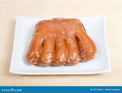 One Bear Claw Donut on Rectangular Plate Stock Image - Image of food, parchment: 212129045