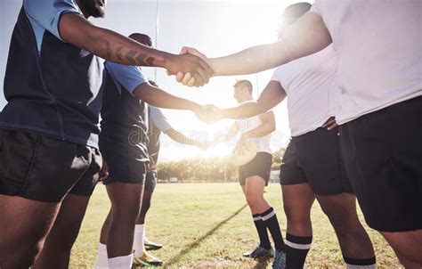 Two Opponent Rugby Teams Shaking Hands Before Or After A Match Outside