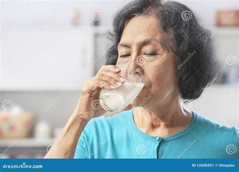 Senior Woman Drinking Milk Stock Image Image 12600421