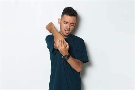 Premium Photo Close Up Man Having Pain In Injured Elbow And Arm