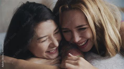 Cute Multiracial Lesbian Girls Hugging In Bed Smiling And Laughing Close Up Portrait Happy