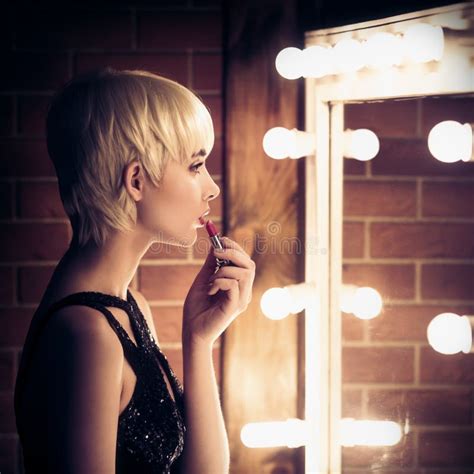 Beautiful Blonde Woman Looking Into A Mirror At Herself Stock Image Image Of Mirror Beautiful
