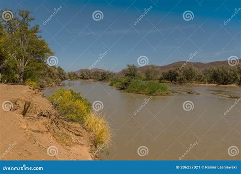 Landscape View Of The Kunene River The Border River Between Namibia