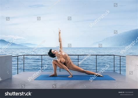 Beautiful Naked Woman Practicing Yoga Poses Stock Photo 1022599495