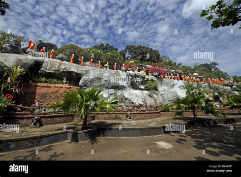 Line Of Orange Monks At The Golden Temple Dambulla Sri Lanka March