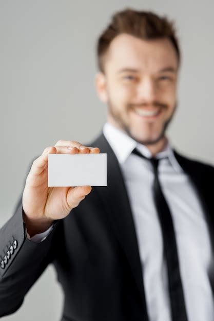 Premium Photo Man Showing His Business Card Cheerful Young Man In