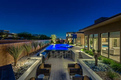 Rim Flow Pool Spa With Sunken Retreat With BBQ And Glass Walled Fire