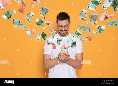 Online Payment Man Buying Something Using Mobile Phone On Orange