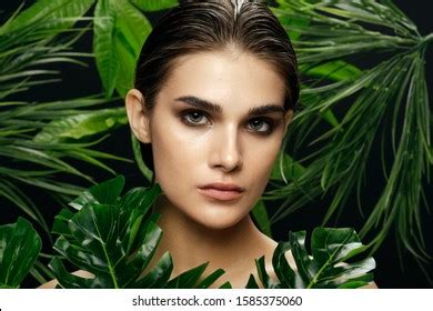 Beautiful Woman Naked Shoulders Palm Leaves Stock Photo