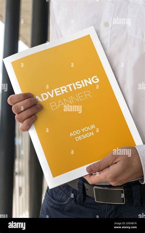 Hand Holding Newspaper Advertising Magazine Brochure Mockup Stock Photo