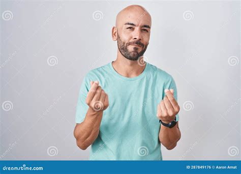 Middle Age Bald Man Standing Over White Background Doing Money Gesture With Hands Asking For