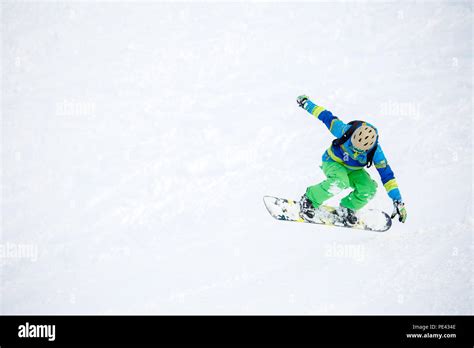 Photo Of Athlete Riding Snowboard Stock Photo Alamy