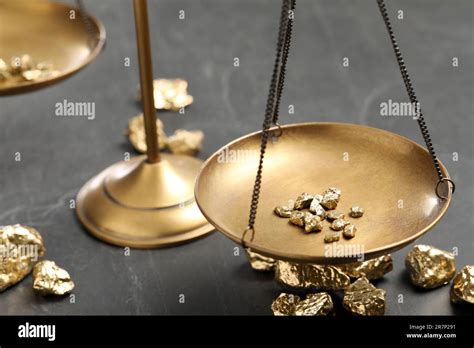 Vintage Scales With Gold Nuggets On Black Marble Table Stock Photo Alamy