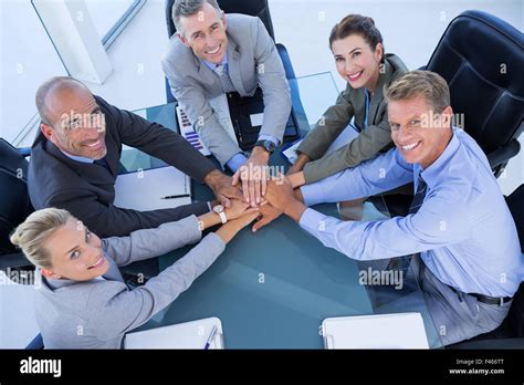 Employees Putting Hands Together Stock Photo Alamy