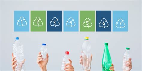 Several People Holding Up Plastic Bottles In Front Of Them