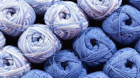 Premium Photo Balls Of Blue Wool Assortment Of Yarn On Display In The