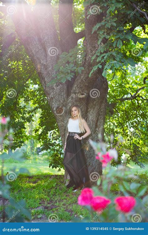 Beautiful Blonde Woman Posing In A Park Stock Image Image Of Fashion Bush
