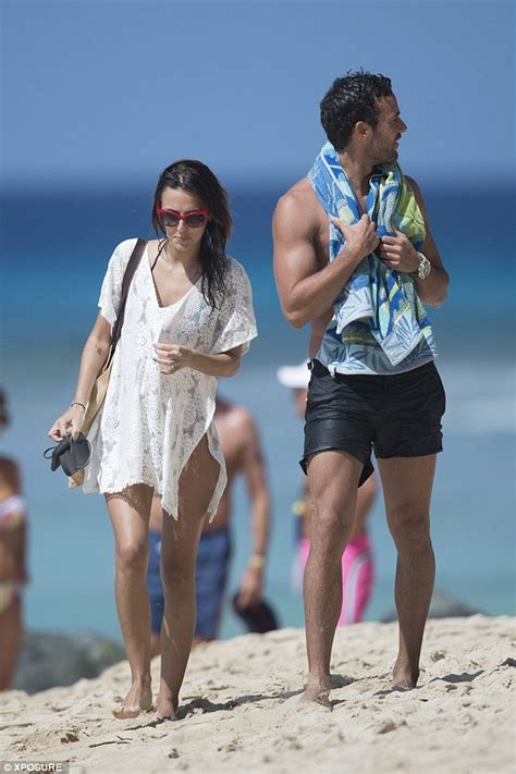 Lucy Watson flaunts her incredible curves and pert derrière in revealing bikini as she continues