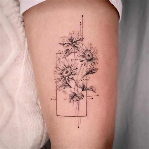 A Woman S Thigh With Sunflowers In A Vase Tattoo On The Side