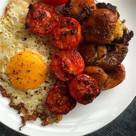 Fried Egg Fried Tomatoes And Fried Potatoes With Lots Of Herbs And Spices Foodporn