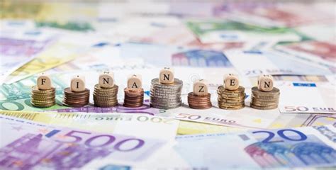 german word finanzen  coin stacks cash background stock photo