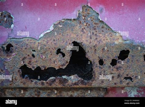 Rusted And Punctured Red Metal Surface Stock Photo Alamy