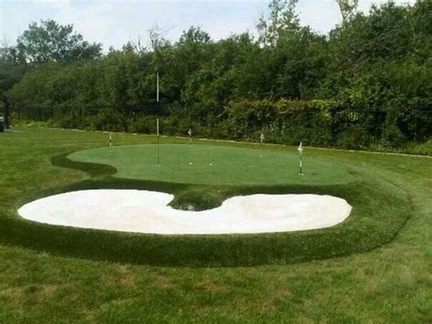 Backyard putting green with sand bunker installed by Krevitz Golf Turf Solutions. | Backyard ...