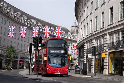 London Bus Under The Flags Stock Photo Download Image Now Bus