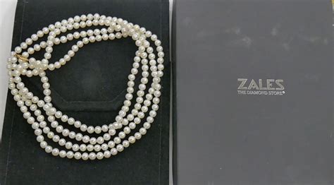 Cash USA Pawnshop. ZALES 64 INCHES LONG PEARL ( 6.25 MM) NECKLACE W 14KT YELLOW GOLD LOCK & BOX