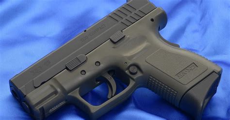 Weapons: Springfield Armory XD9 Subcompact chambered in 9mm with OD frame and Pearce magazine ...