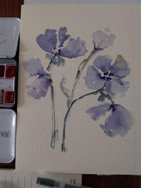 Watercolors Are Being Used To Paint Purple Flowers