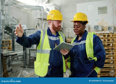 Confident Engineer Explaining His Colleague Technical Moments Of New