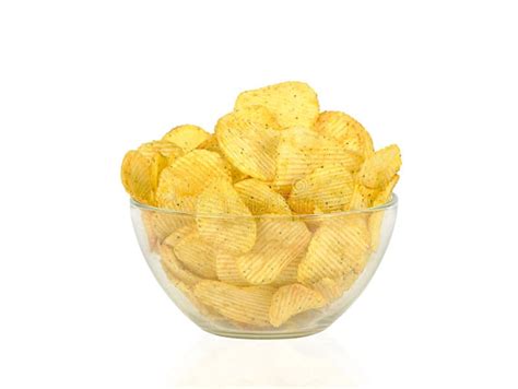 Closeup Of A Glass Bowl With Corrugated Potato Chips Stock Photo