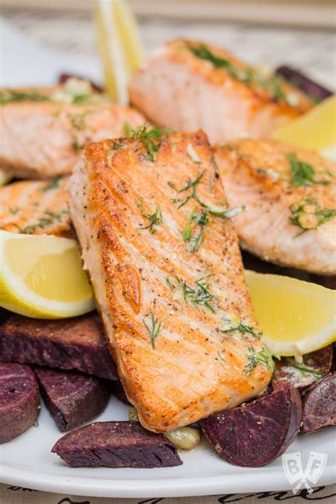 Pan Seared Salmon With Lemon Dill Butter Roasted Purple Sweet Potatoes Garlic Fresh Herbs