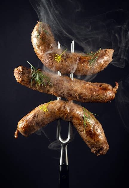Premium Photo Steamed Hot Fried Bavarian Sausages With Dill On A Fork Idea For Hotel Menu Or