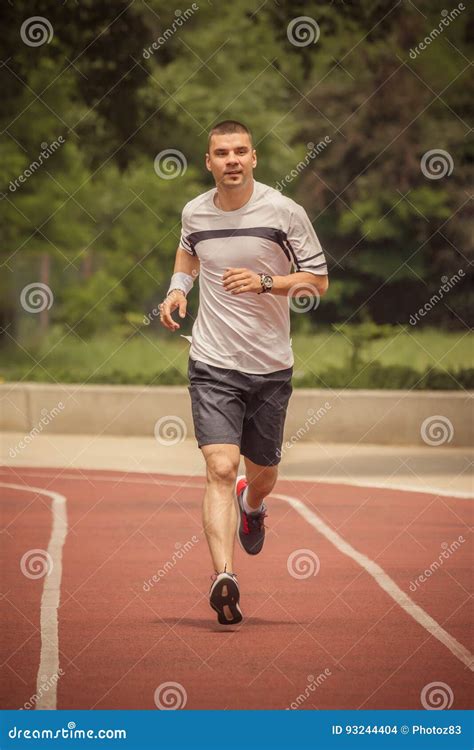 Jogger Running On The Running Track Stock Photo Image Of Muscular