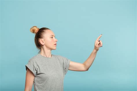 Premium Photo Thoughtful Woman Reaching To Press Invisible Button On