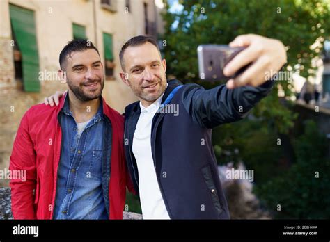 Gay Couple Making A Selfie With Their Smartphone Stock Photo Alamy