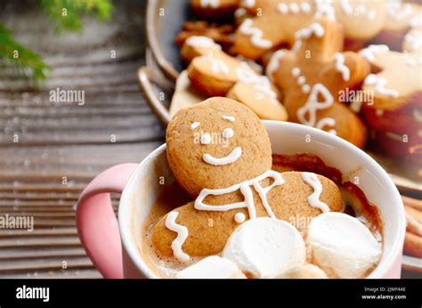 Pink Mug With Hot Chocolate Marshmallows And Gingerbread Man Closeup Stock Photo Alamy