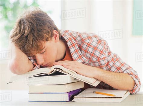 Teenage Boy 14 15 Sleeping In Classroom Stock Photo Dissolve