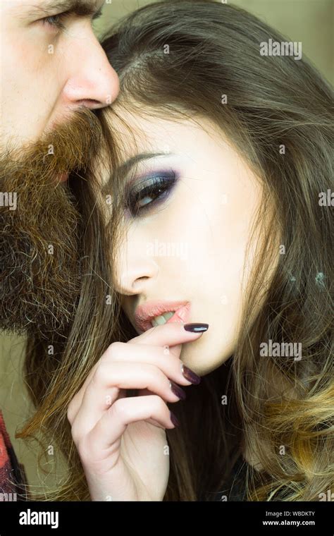 Bearded Man Looks Far Away While Lovely Brunette Woman Pose With Cute Face Stock Photo Alamy