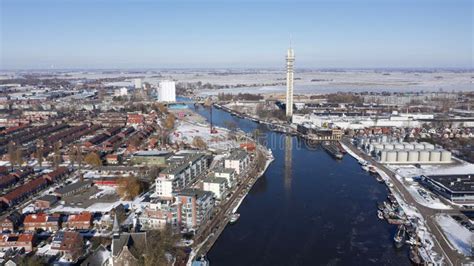 Aerial View of a Snowy City with a River Stock Photo - Image of winter ...