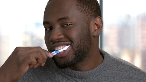 Man Brushing Teeth