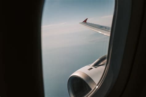 View Of The Clouds From An Airplane Window · Free Stock Photo