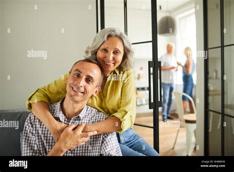 Portrait Smiling Mature Woman Sitting Couch Home Hi Res Stock Photography And Images Alamy