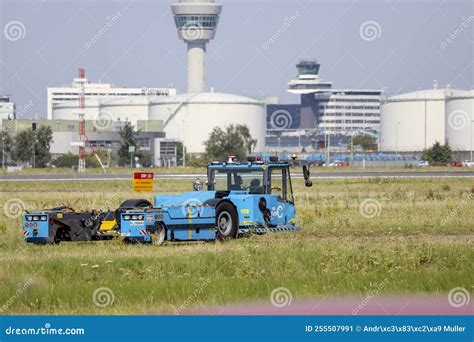 Aircraft Tractor Of The Klm On Taxi Strip Next To Aalsmeer Runway On