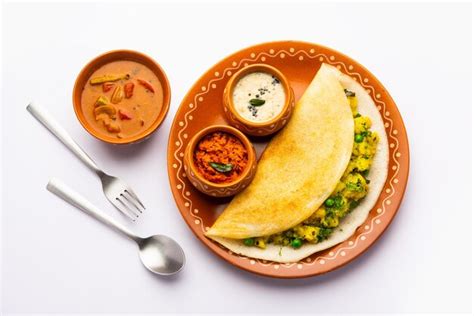 Premium Photo A Dosa Also Called Dosai Dosey Or Dosha Is A Thin