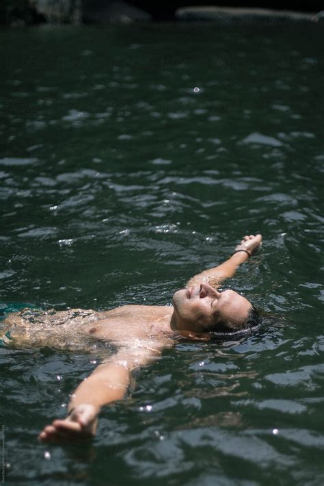 Man Relaxing In Water Del Colaborador De Stocksy Diane