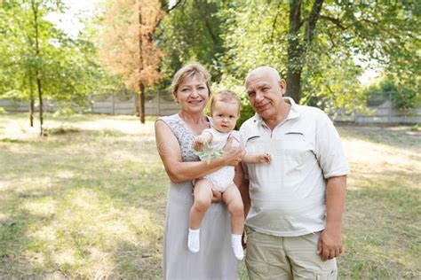 Grandparents Taking Care Grandchild Outdoors Stock Image Image Of